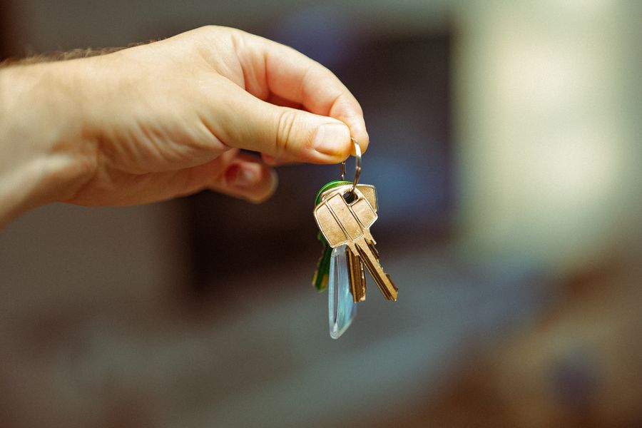 Hand holding a ring of house keys